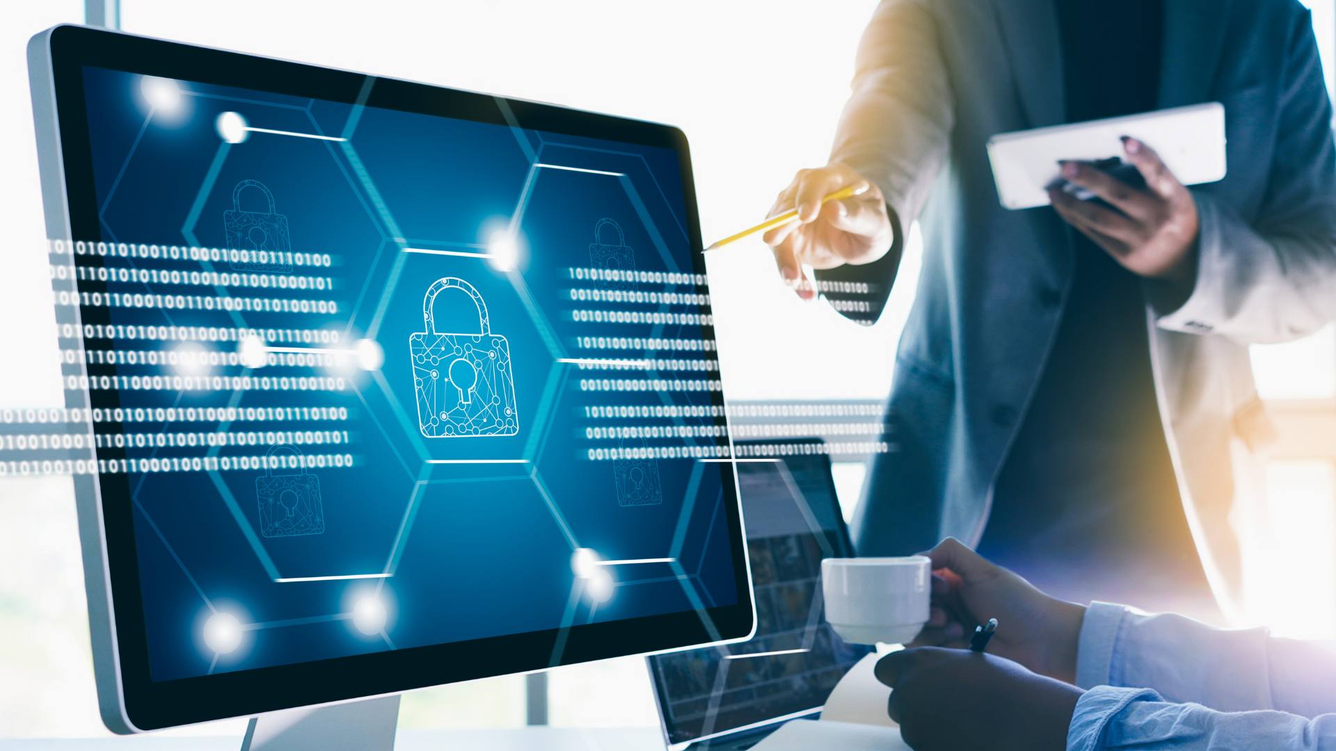 Security analyst working with protected data on a laptop